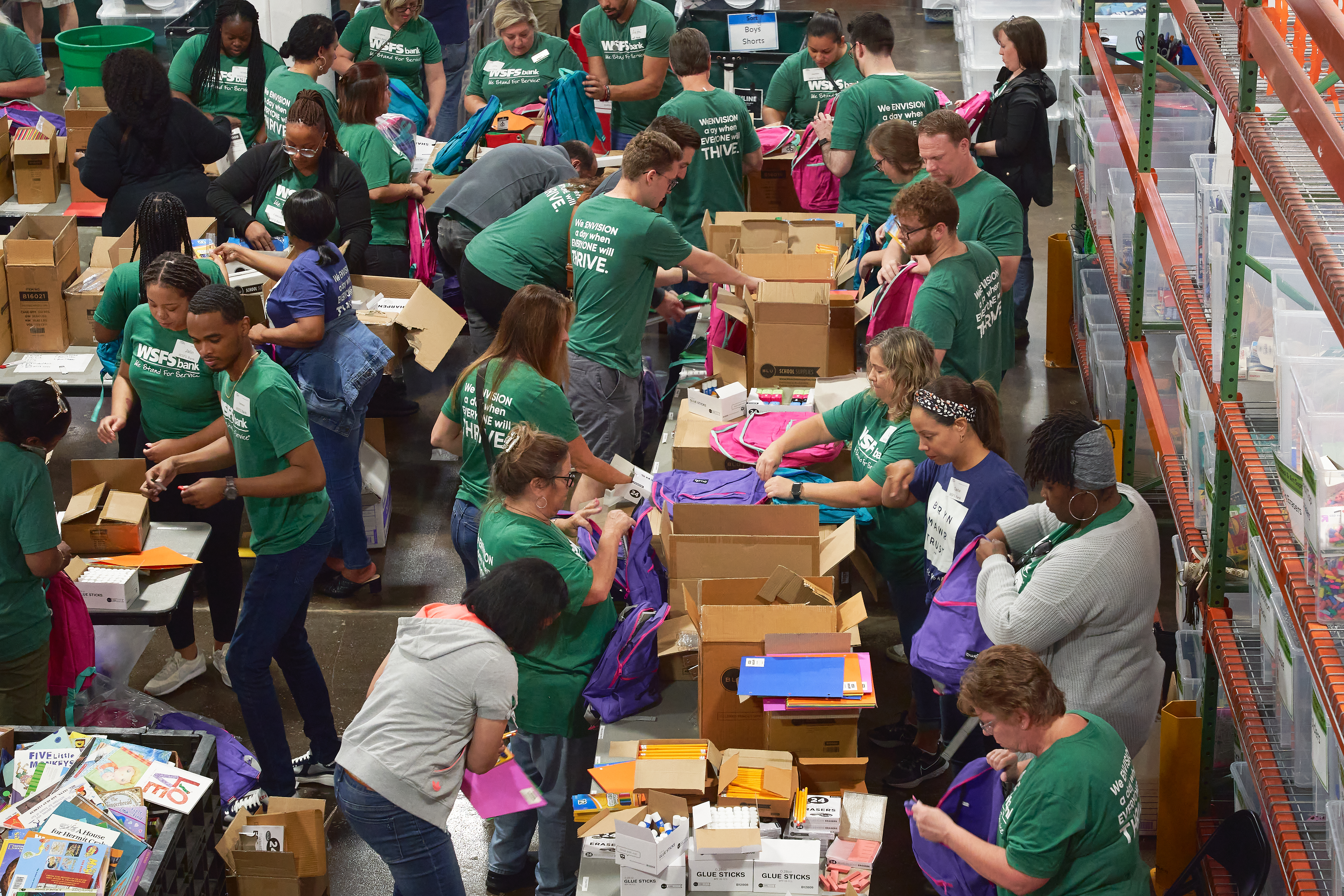 Volunteers sort and pack donated items at Cradles to Crayons in Philadelphia, Pa. for distribution to those in need.